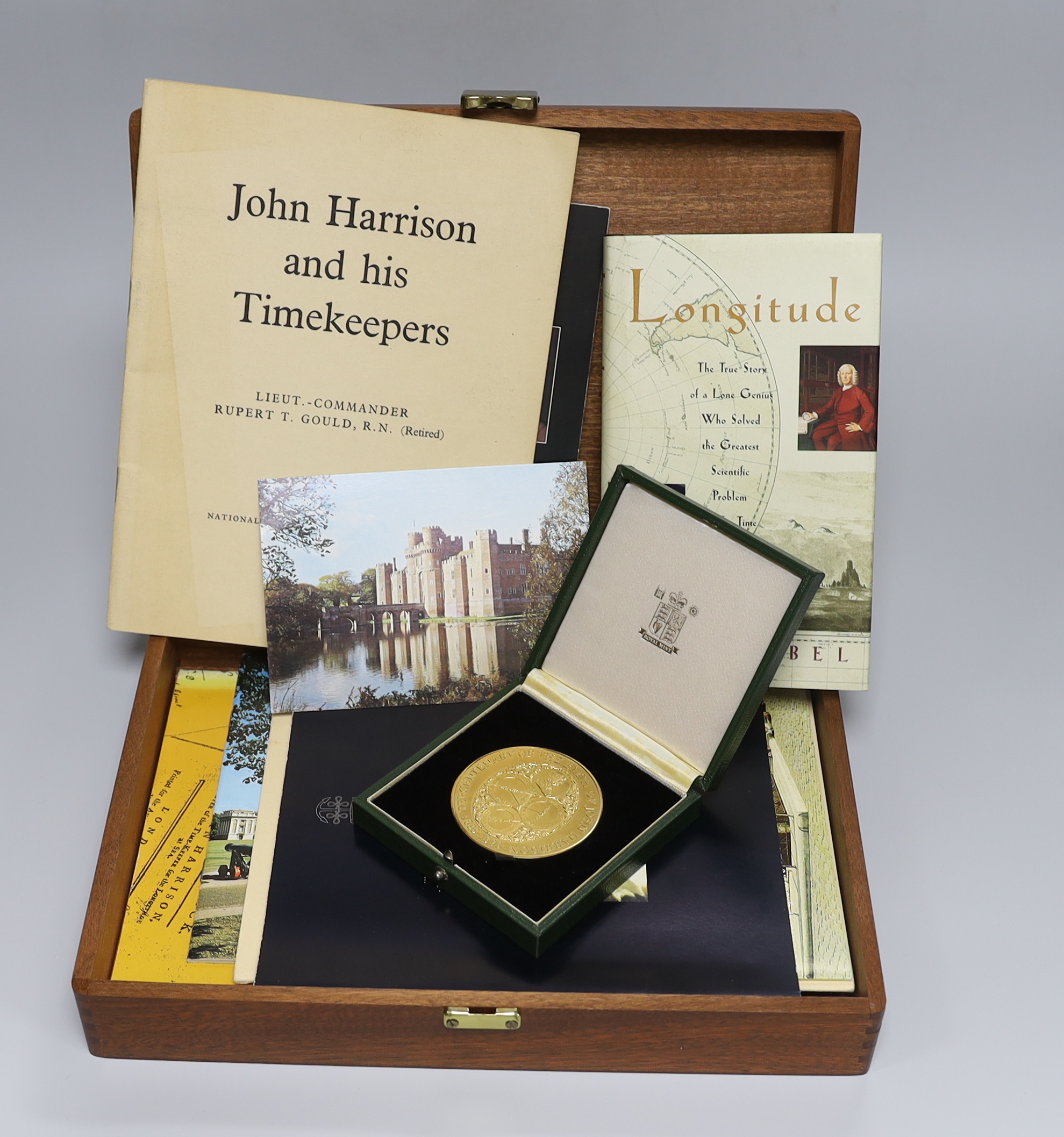 A cased Royal Mint 9ct gold limited edition commemorative gold medal 'Tercentenary of the Birth of John Harrison, 1693-1993', with certificate and paperwork